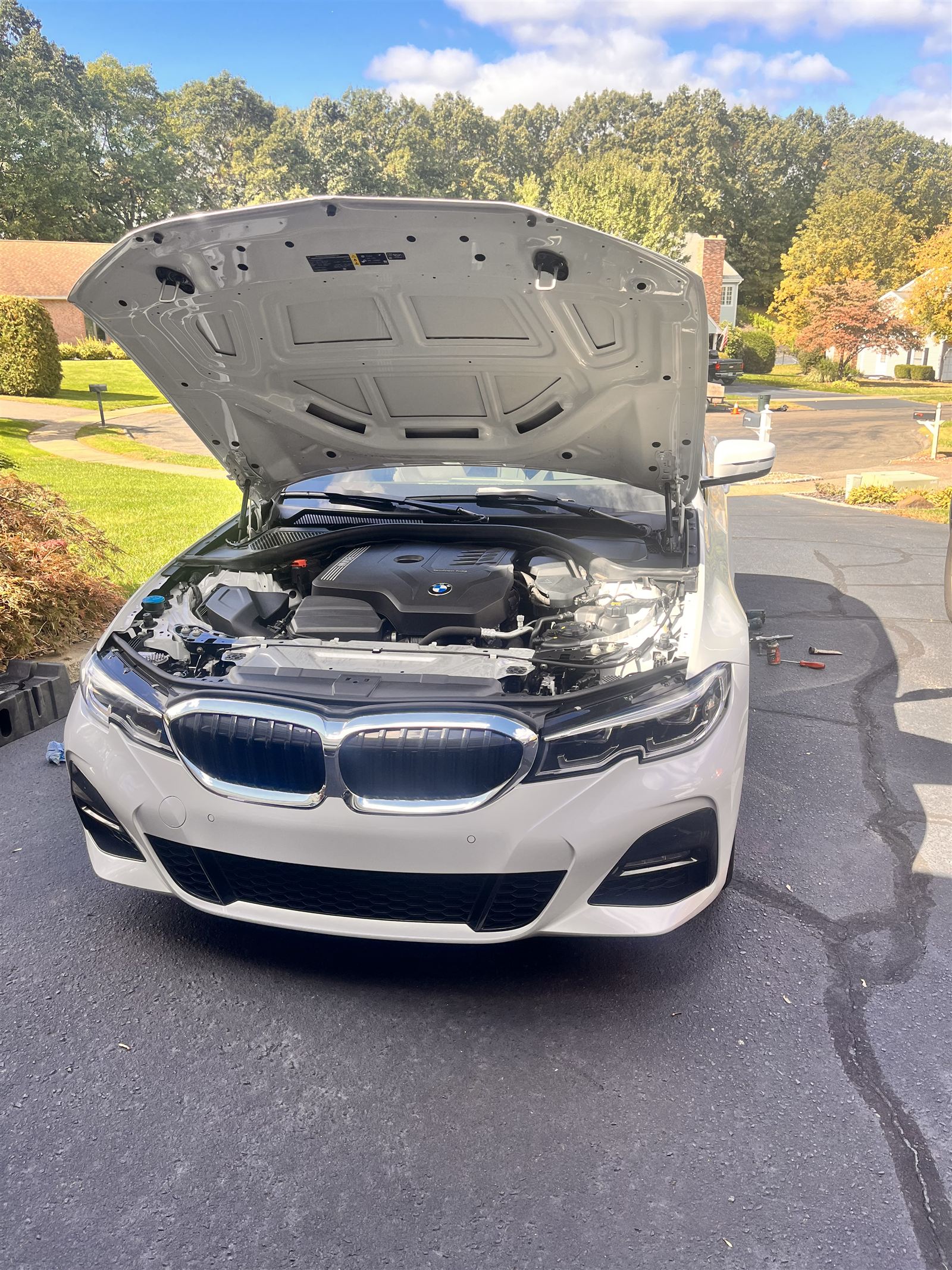 On-site BMW engine service in a customer's driveway